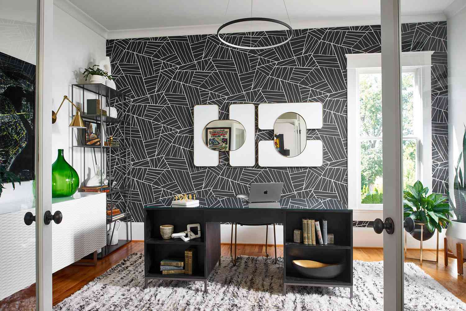 Modern accent wall with geometric wallpaper pattern